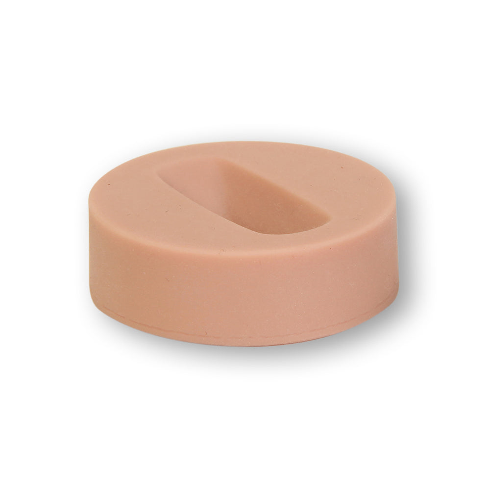 Round Insert Of Dermalike II™ To Simulate "Tipping" Port