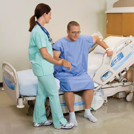 Male Patient in Advanta 2 Hospital Bed with Nurse